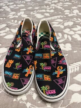 Vans Black Slip-On Sneakers with Neon Multi Graphics